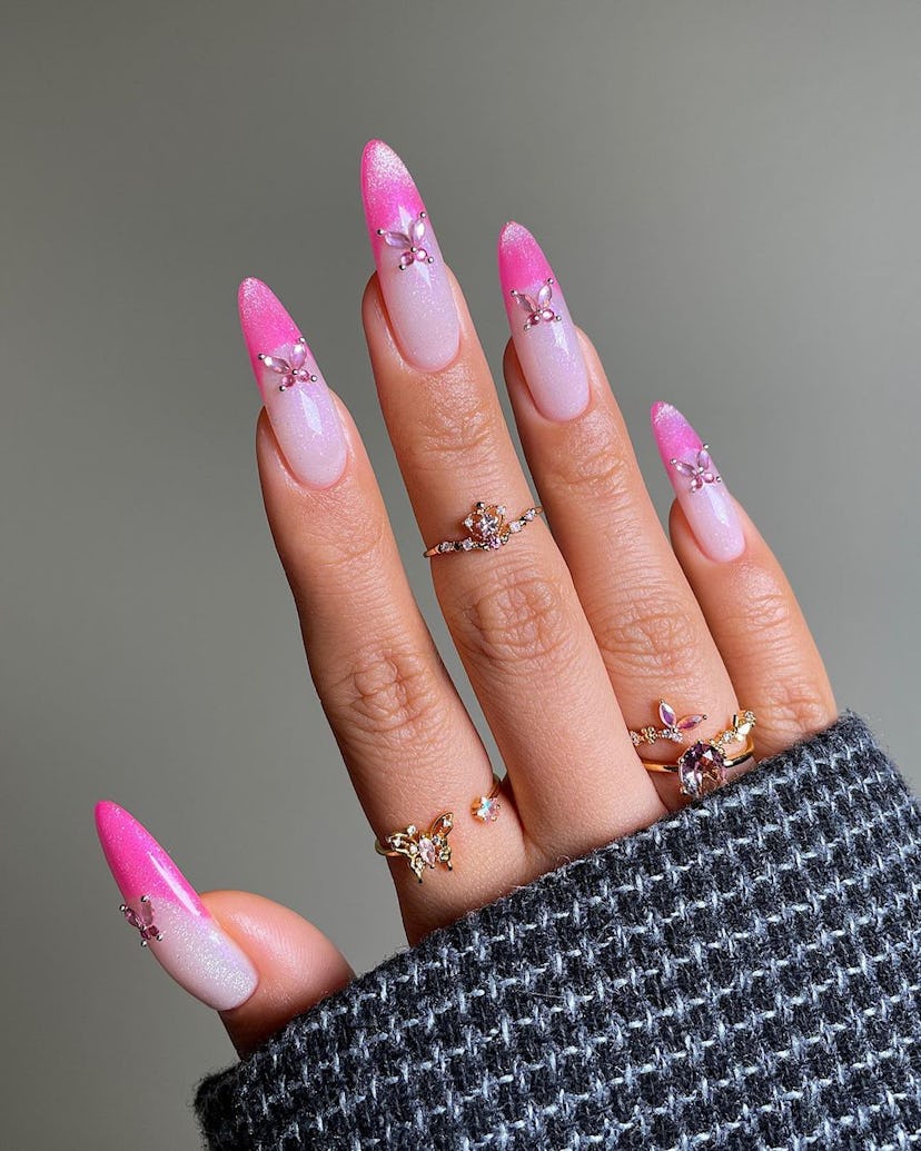 For nail designs inspired by your zodiac sign, hot pink French tips with glitter are one of the best...