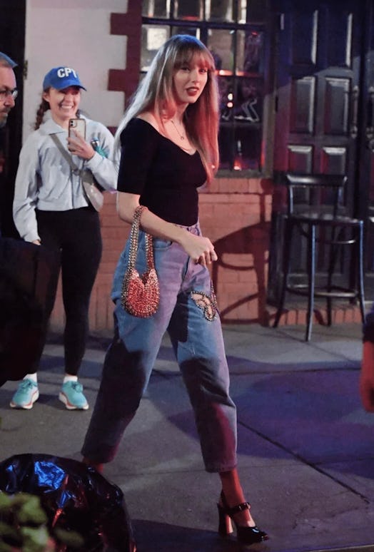 Taylor Swift wears a pair of Crystal Butterfly Area jeans while in New York City.