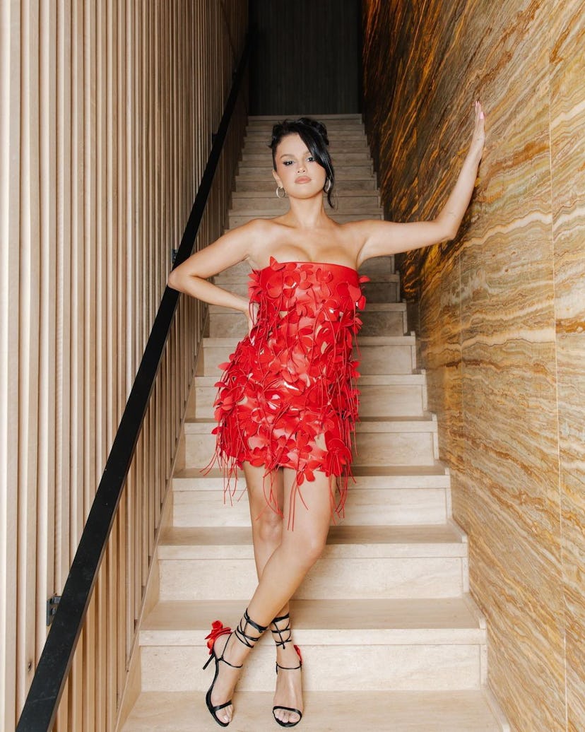 Selena Gomez wears a red Bottega Veneta dress for her 31st birthday.