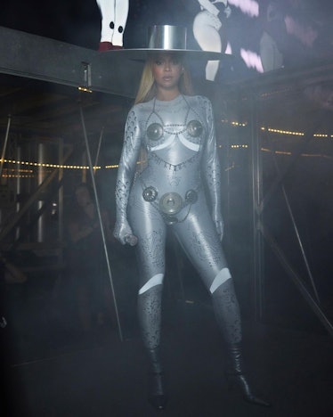 Beyoncé wears a custom Marine Serre bodysuit and chain bra during her Renaissance world tour.