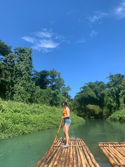 Editor Sarah Ellis bamboo rafting on the Martha Brae in Jamaica, an activity planned based on her zo...