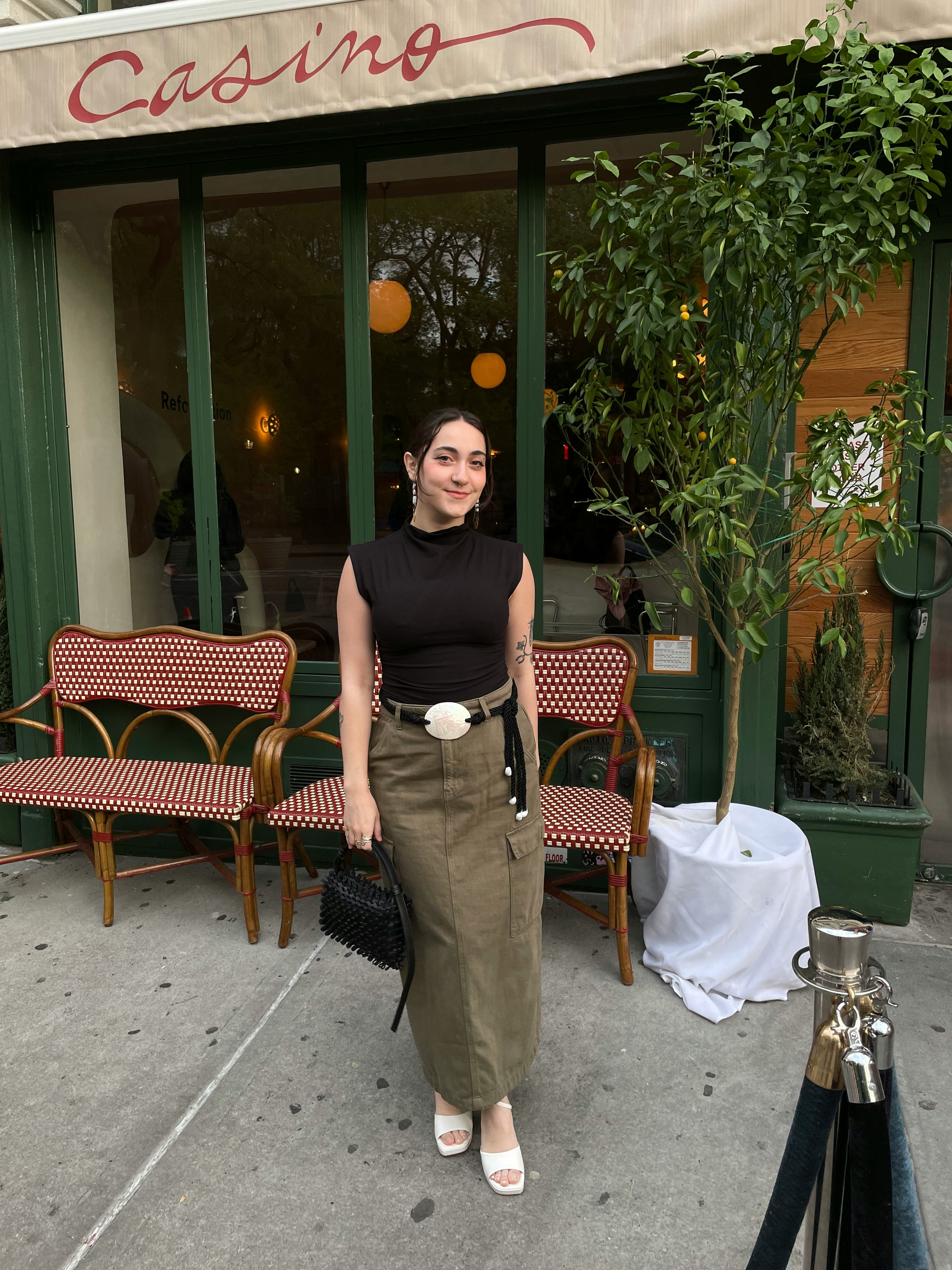 bustle digital group&rsquo;s editorial operations manager abby lebet wears reformation&rsquo;s lindy knit top