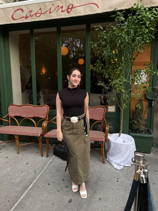 bustle digital group’s editorial operations manager abby lebet wears reformation’s lindy knit top