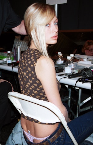  Paris Hilton gets ready backstage during Lloyd Klein's presentation of his fall/winter 2001 collect...