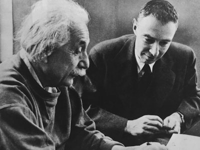 black and white photo of Albert Einstein and J Robert Oppenheimer