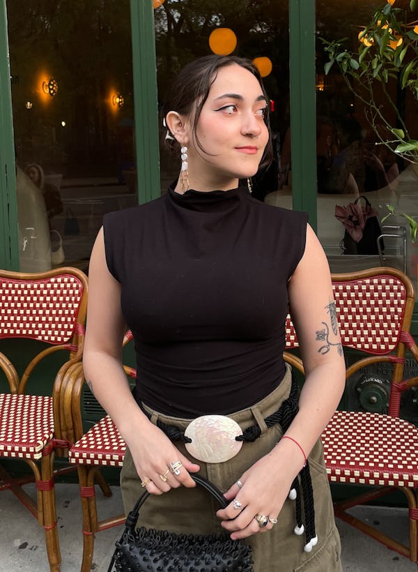 bustle digital group’s editorial operations manager abby lebet wears reformation’s lindy knit top