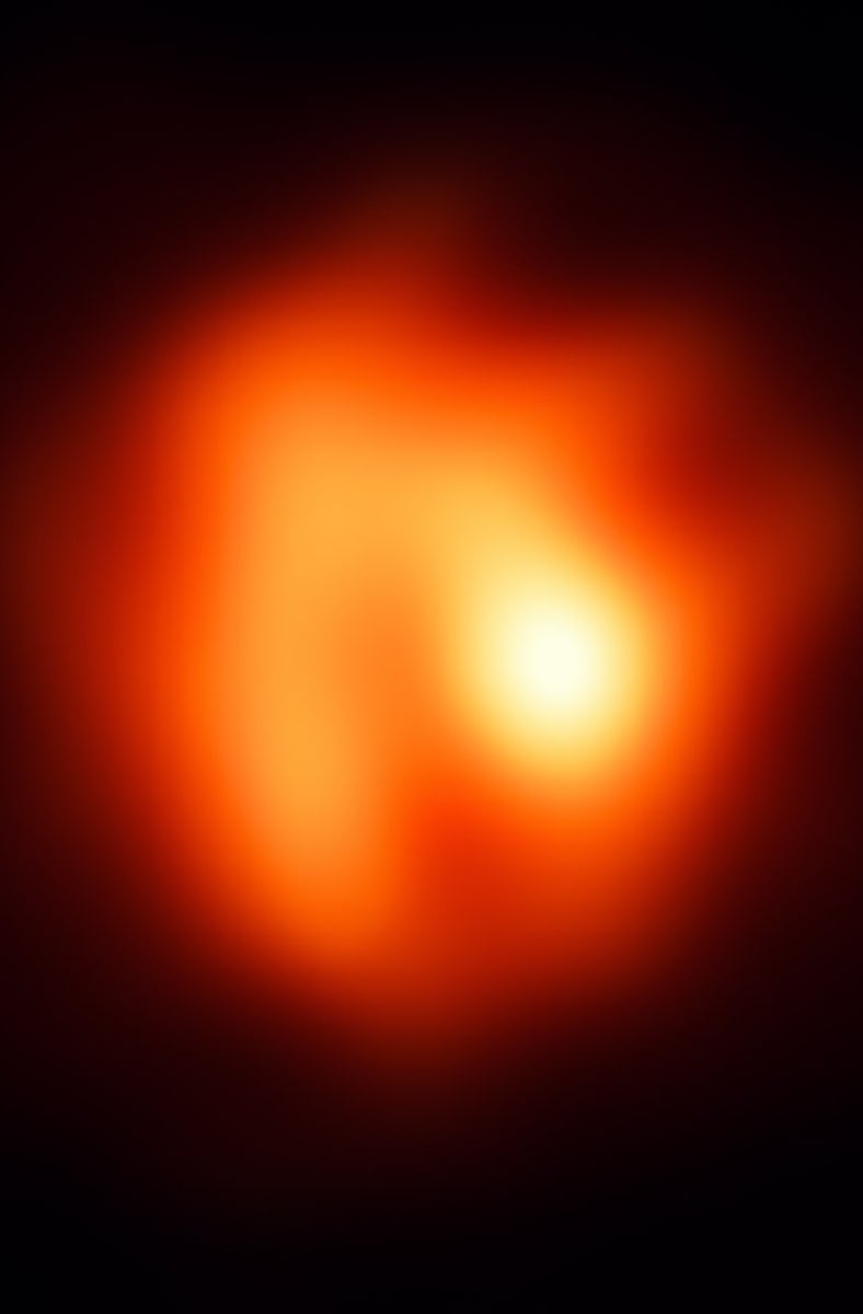 a red and orange disk on a black background, with a yellow bright spot