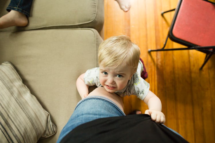 A child pulls on their jellyfish parent's shirt while whining.