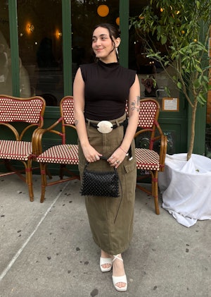 bustle digital group's editorial operations manager abby lebet wears reformation's lindy knit top