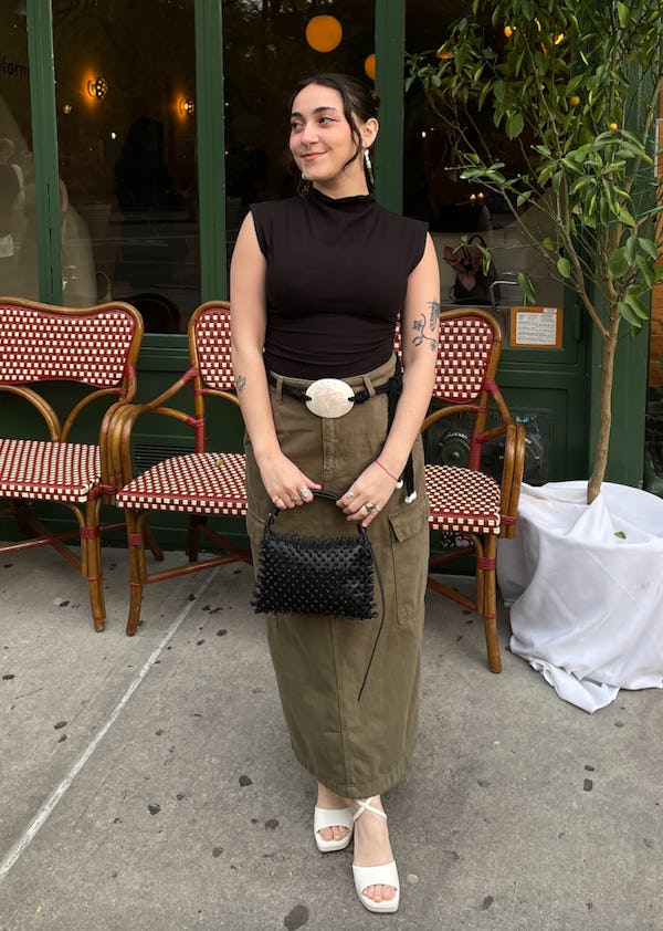 bustle digital group’s editorial operations manager abby lebet wears reformation’s lindy knit top