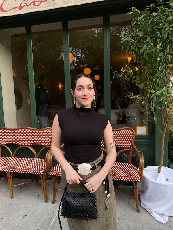 bustle digital group’s editorial operations manager abby lebet wears reformation’s lindy knit top