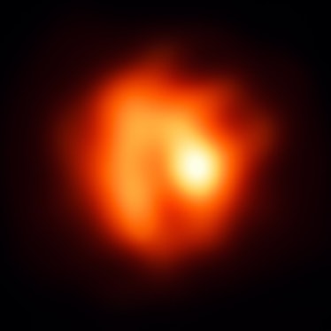 a red and orange disk on a black background, with a yellow bright spot