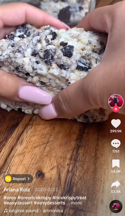 A young woman pulls apart an Oreo Rice Krispie Treat in a video on TikTok.