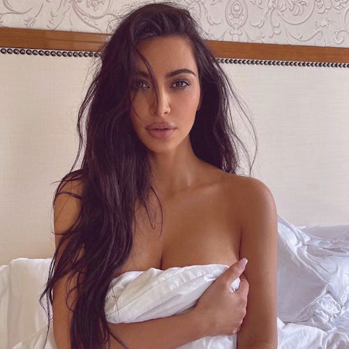 Kim Kardashian bedsheet and long hair 2022