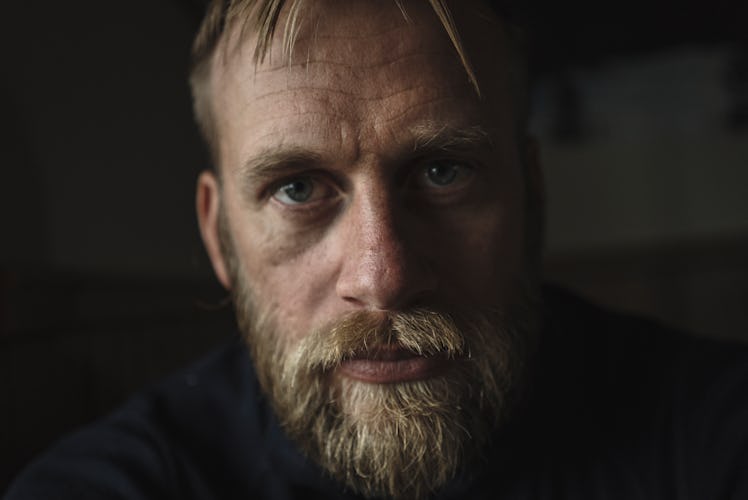 Man staring into camera, looking serious
