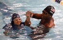 U.S. Olympic swimmer Cullen Jones teaches kids to swim during the Make A Splash event at Chelsea Rec...
