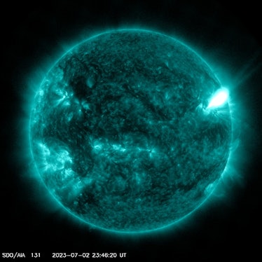A solar flare erupted from the Sun on July 2, 2023. It appears like a vivid absence of color on the ...