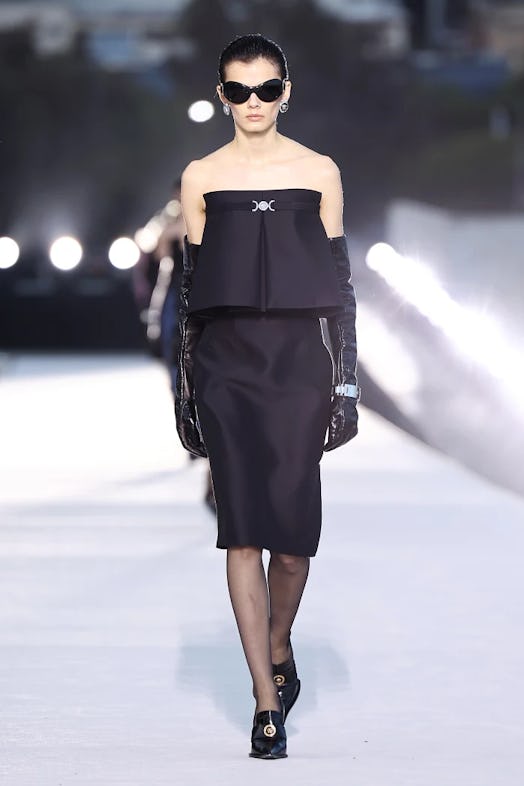 A model walks the runway during the Versace Fall/Winter 2023 fashion show on March 9, 2023, in West ...