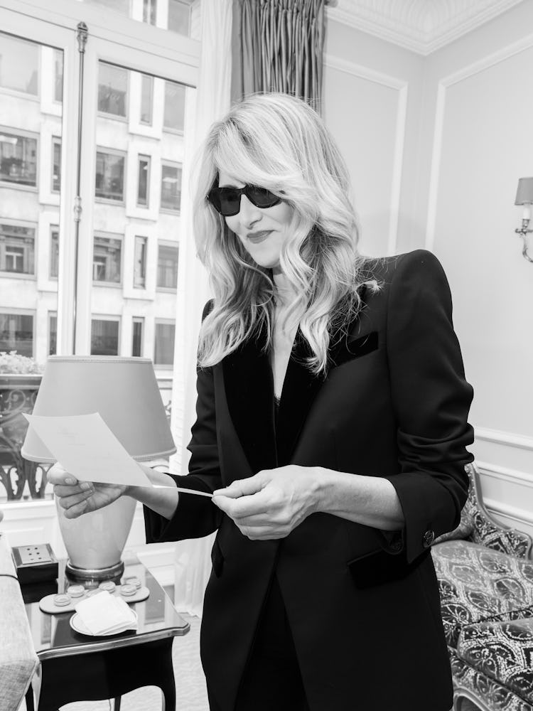 laura dern in black sunglasses and a black suit