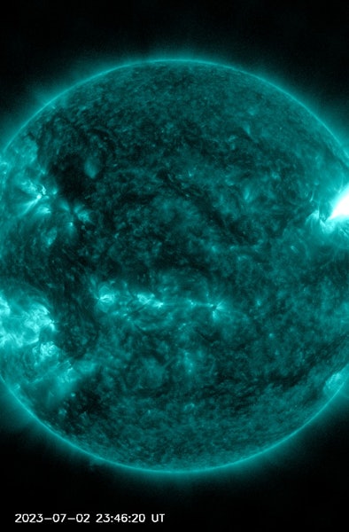 A solar flare erupted from the Sun on July 2, 2023. It appears like a vivid absence of color on the ...