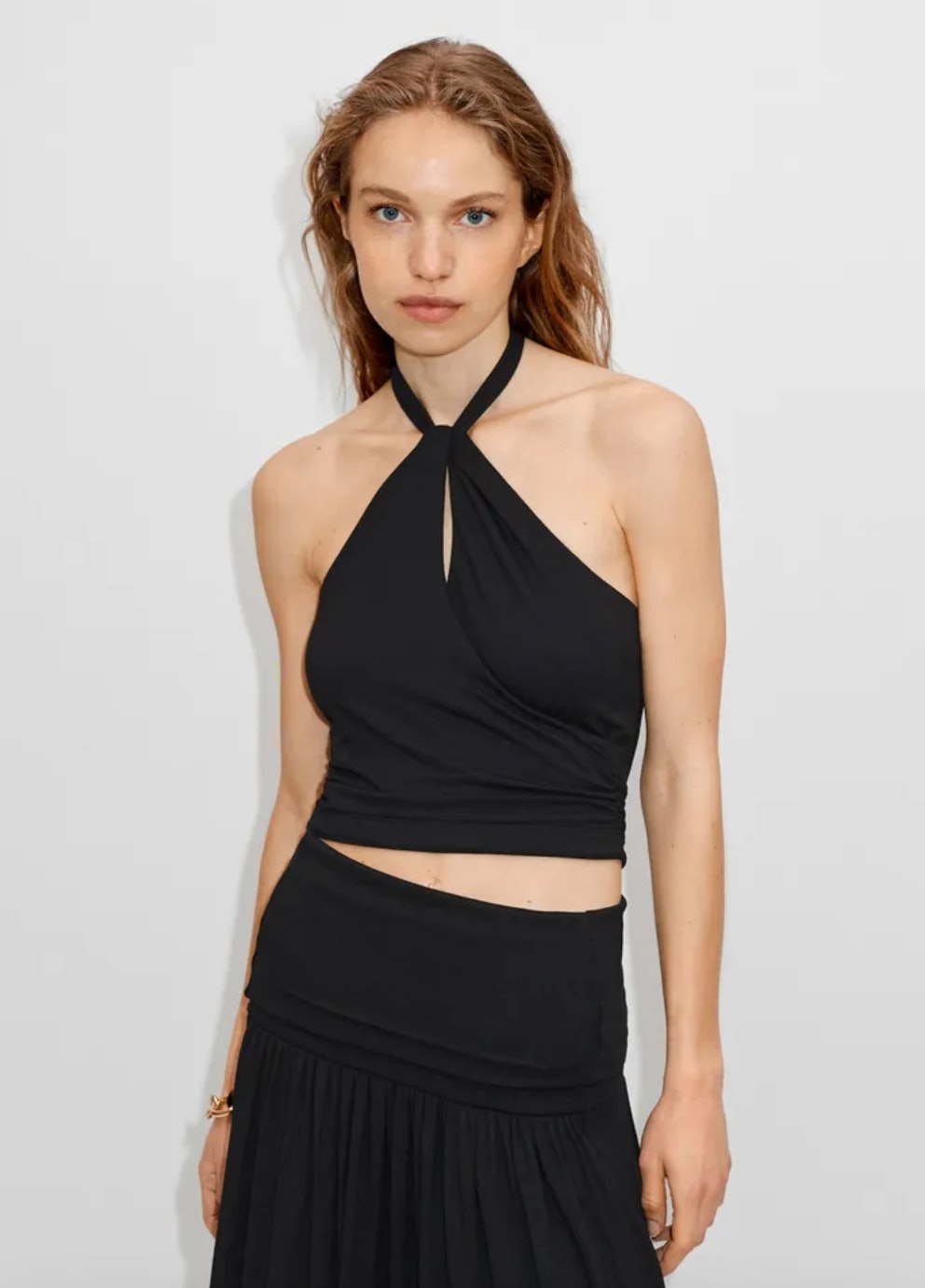 8 Halter Top Outfits That Showcase The Garment's Versatility
