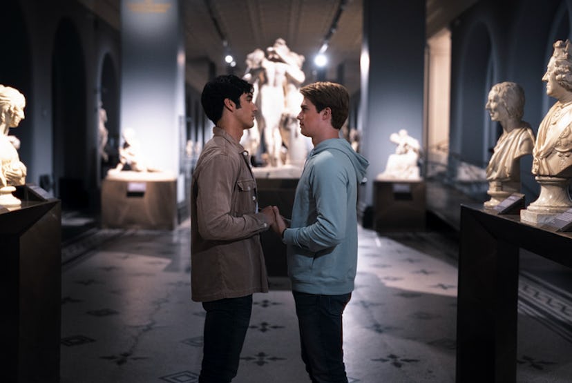 Alex and Henry share a romantic moment in an art gallery.