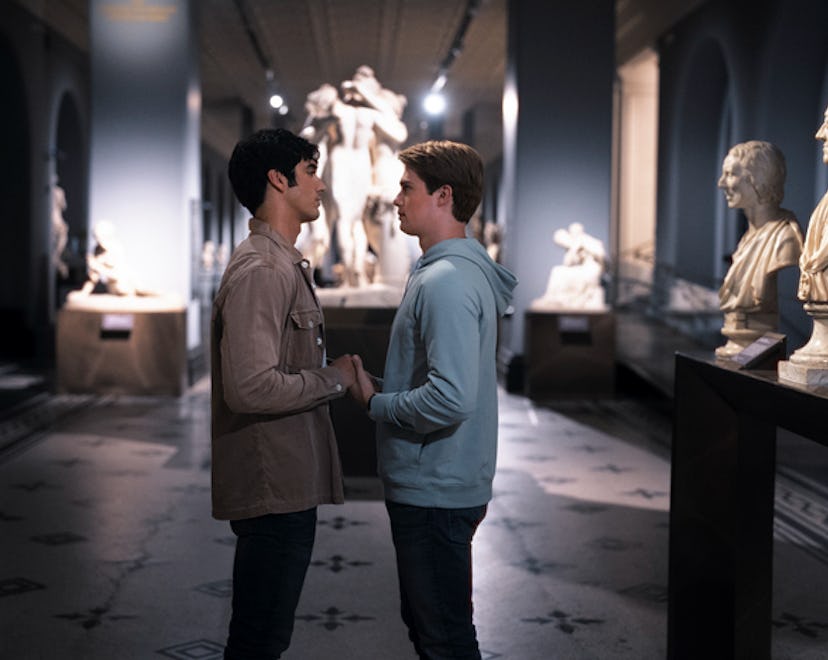 Alex and Henry share a romantic moment in an art gallery.