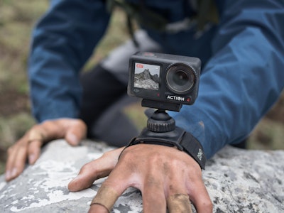 DJI's Osmo Action 4 action camera with included wrist-strap accessory