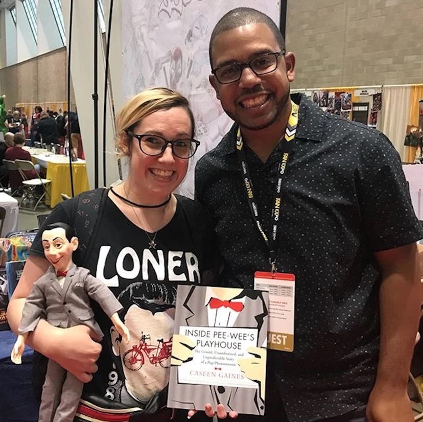 Author Caseen Gaines (RIGHT) with a Pee-wee fan, and his nonfiction book, Inside Pee-wee's Playhouse...