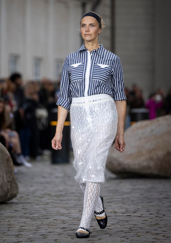 A model walks the runway at the Baum und Pferdgarten show during Copenhagen Fashion Week Spring/Summ...