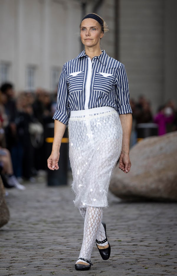 A model walks the runway at the Baum und Pferdgarten show during Copenhagen Fashion Week Spring/Summ...