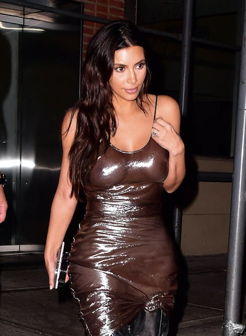 kim kardashian wears a silver see-through dress exposing her nipples