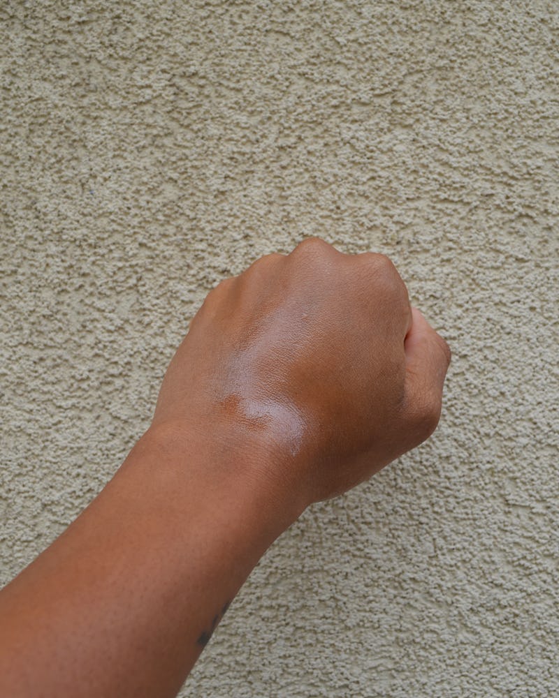 An image of a hand that has been sprayed with the Milani Make It Last SPF 30 Setting Spray