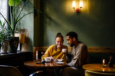 Man and woman at restaurant on intimate date.