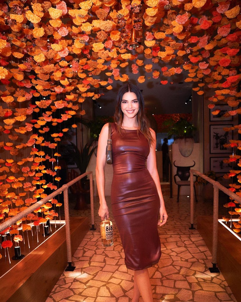 Kendall Jenner wears a bodycon leather dress during an event for her tequila brand 818 in Las Vegas.
