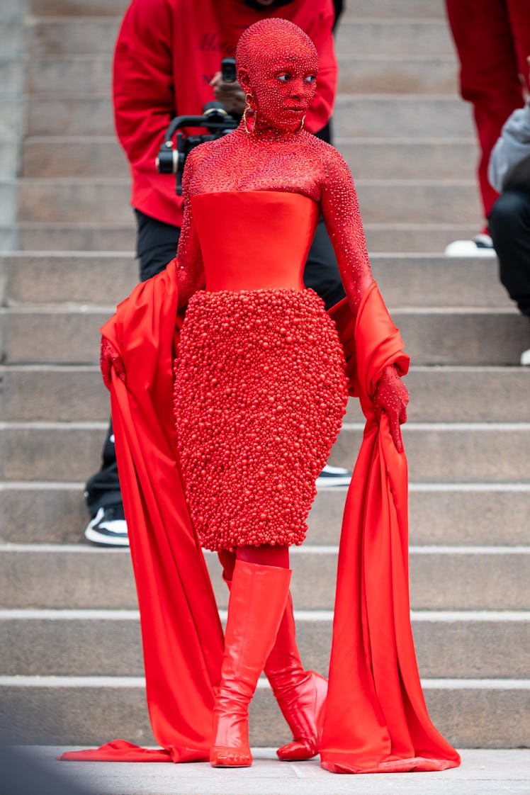  Doja Cat wears a red Schiaparelli total look and red makeup all over the body, outside Schiaparelli...