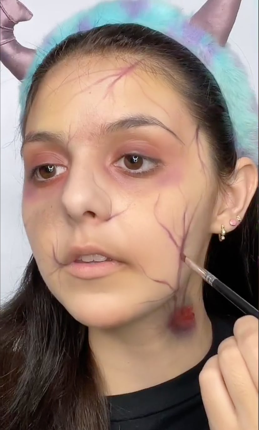 a girl with fake zombie makeup