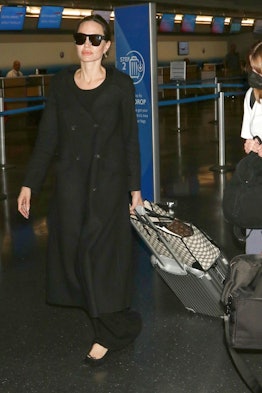 Angelina Jolie was seen arriving at JFK Airport in New York City, accompanied by two of her children...