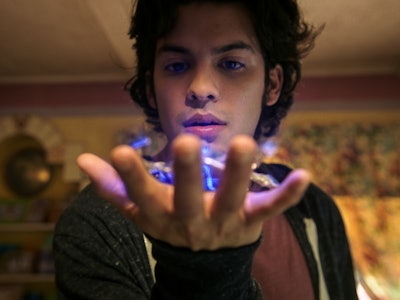 Jaime Reyes (Xolo Maridueña) holds the Scarab in 'Blue Beetle'