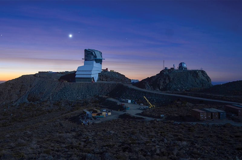 an observatory on a hillside at night