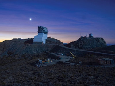 an observatory on a hillside at night