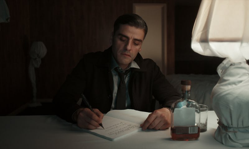 Oscar Isaac Writing at a Desk The Card Counter