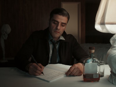 Oscar Isaac Writing at a Desk The Card Counter