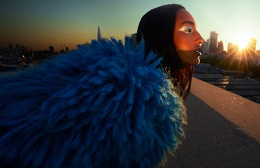 Model Mona Tougaard wears a blue hairy coat.