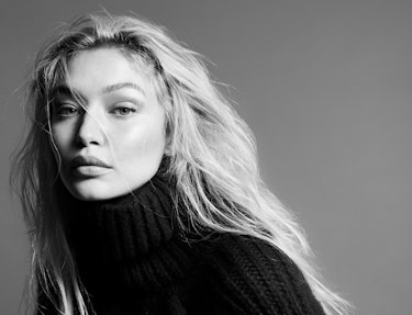 Model Gigi Hadid wears a black knit turtleneck sweater.