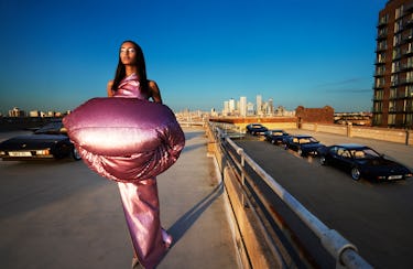 Model Mona Tougaard wears a rose gold jacket, gown and shoes.