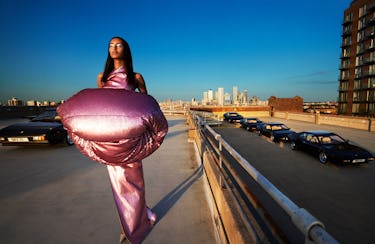 Model Mona Tougaard wears a rose gold jacket, gown and shoes. 