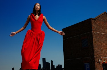 ModelcMona Tougaard wears a red dress.
