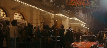 A crowd gathers for a movie premiere in Loki season 2