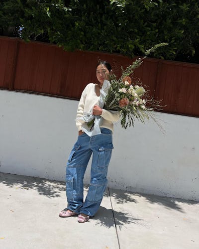 Aimee Song wears cargo jeans.